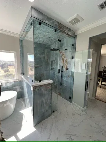 Custom frameless shower with matte black hardware